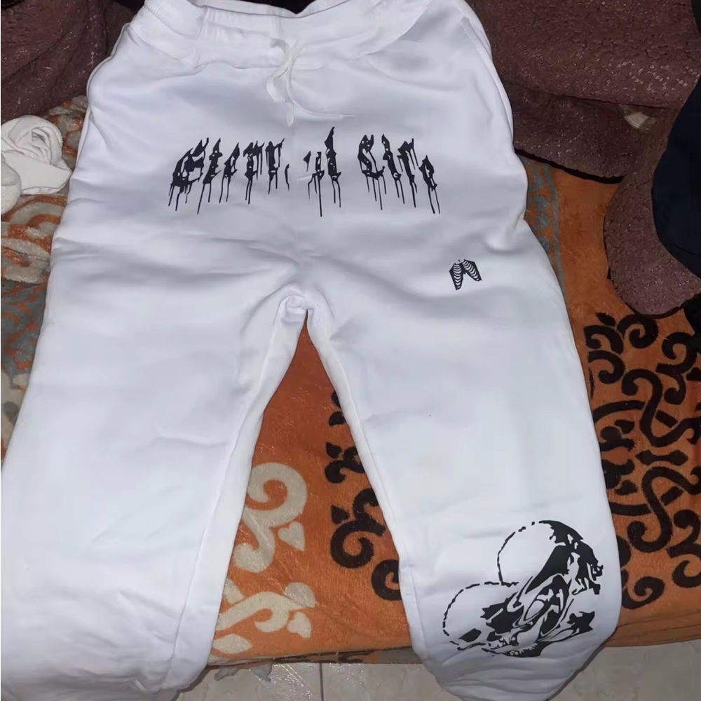 White Joggers with Black Dripping Text and Cartoon Graphic